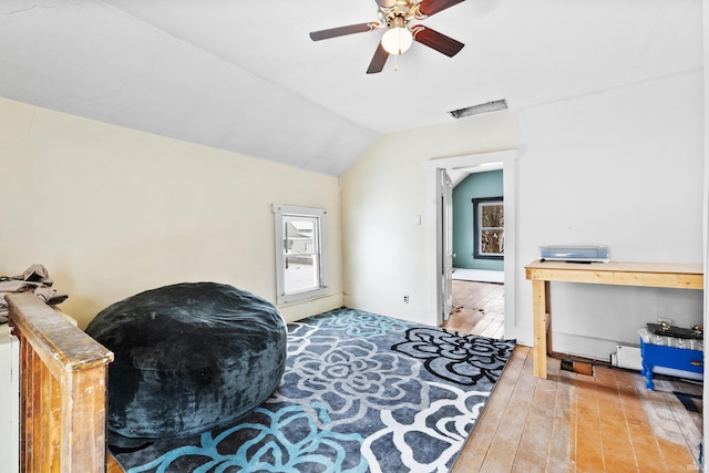 sitting room featuring lofted ceiling, wood-type flooring, and ceiling fan