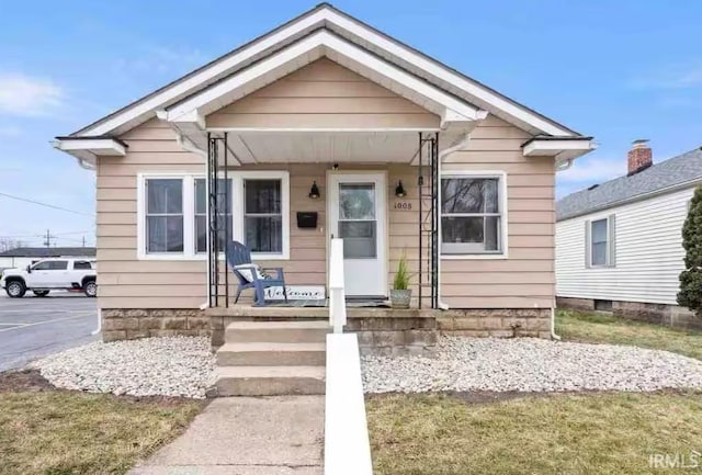 bungalow-style house featuring covered porch