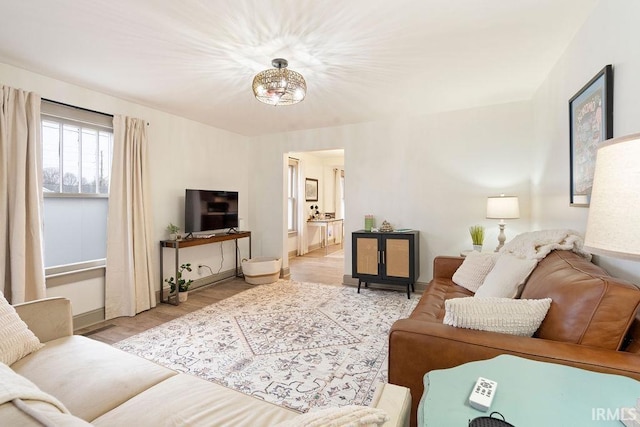 living room with light hardwood / wood-style flooring