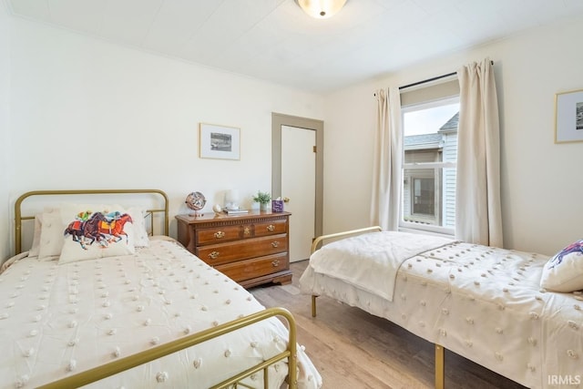 bedroom with light wood-type flooring