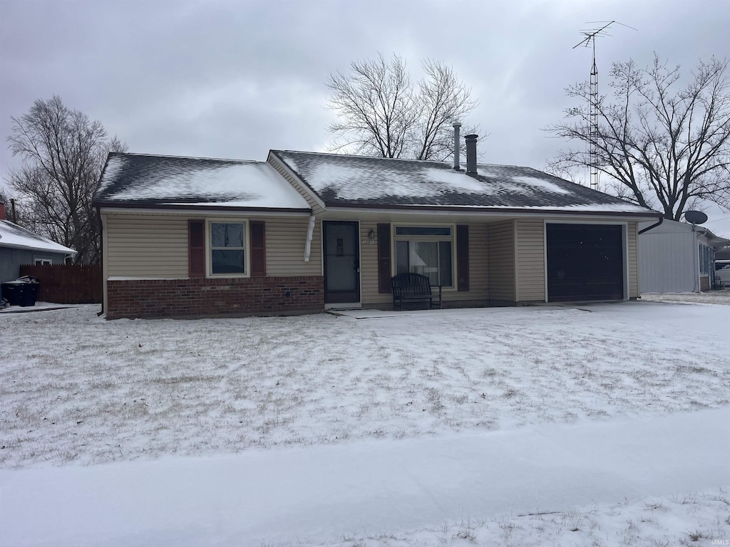 ranch-style house featuring a garage