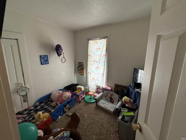 carpeted bedroom with a textured ceiling