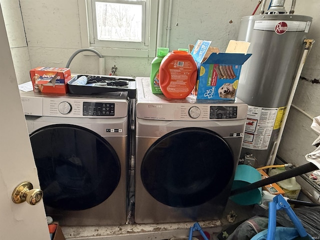 washroom featuring independent washer and dryer and gas water heater