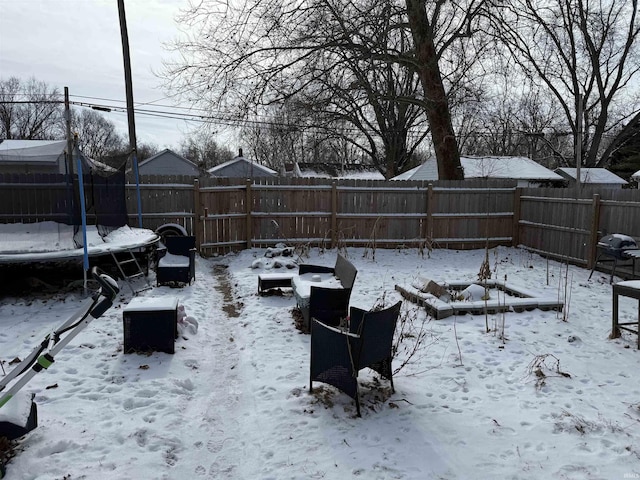 view of yard covered in snow