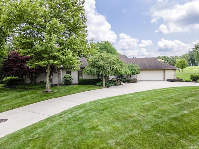 view of front of home with a garage and a front yard