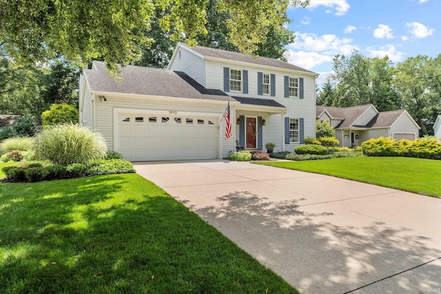 view of front of house featuring a front lawn and a garage