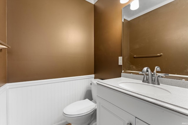 bathroom featuring toilet and vanity