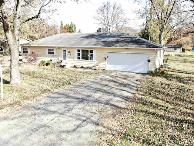 ranch-style home featuring a garage