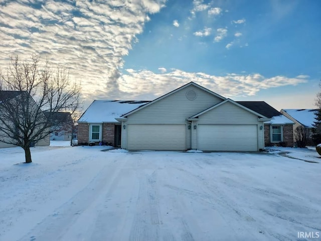 ranch-style house featuring a garage