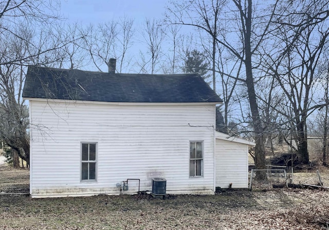 view of side of home featuring central air condition unit