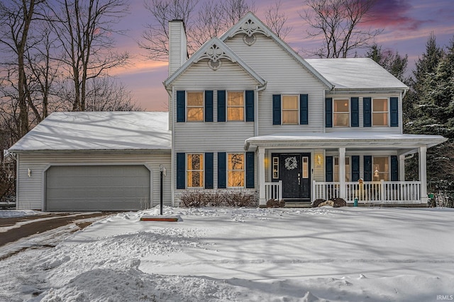 view of front of house with a garage and covered porch