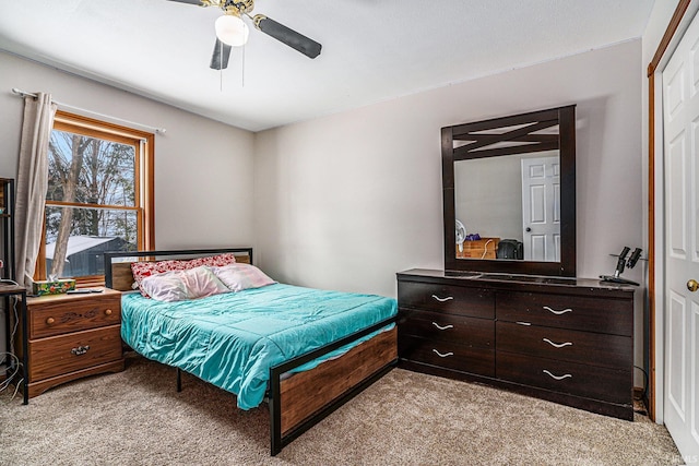 carpeted bedroom featuring ceiling fan