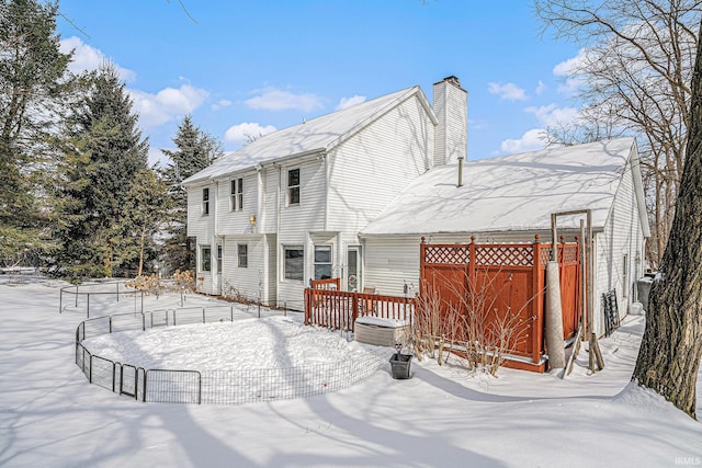 view of snow covered house
