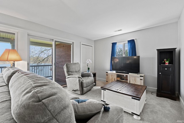 carpeted living room featuring a wealth of natural light