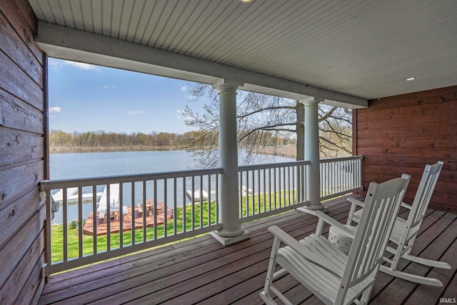 wooden deck featuring a water view