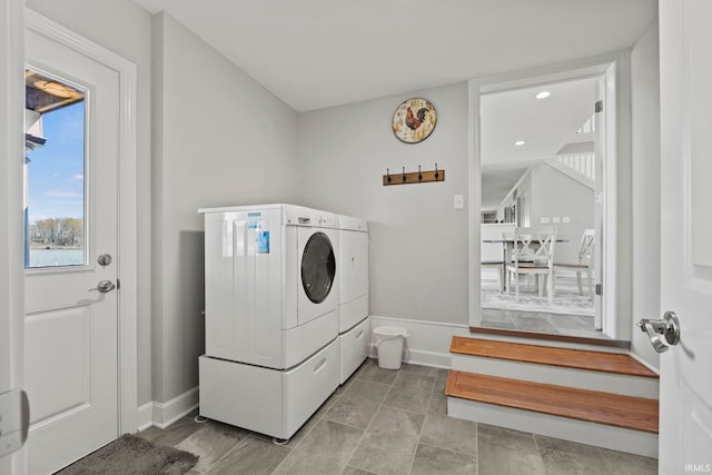 washroom with washer and dryer