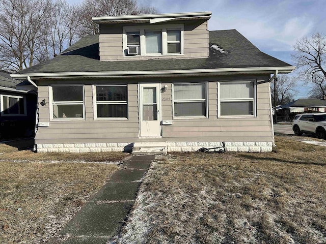 bungalow-style home featuring cooling unit