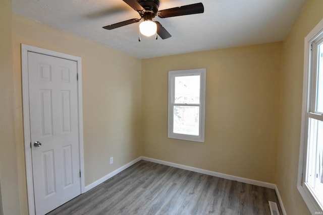 unfurnished room with light hardwood / wood-style flooring and ceiling fan