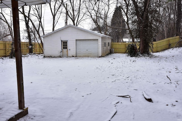 view of snow covered garage