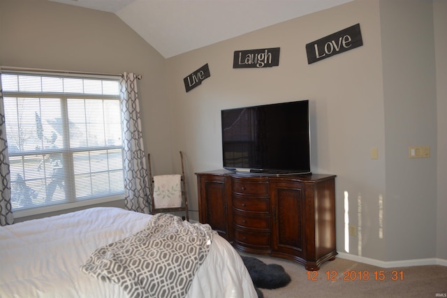 bedroom featuring baseboards, vaulted ceiling, and carpet flooring