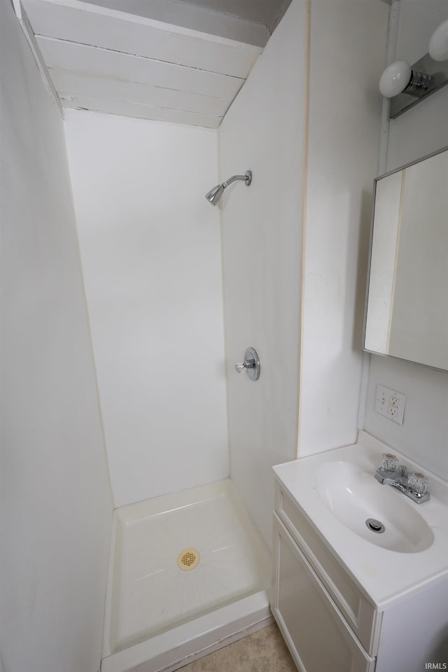 bathroom featuring vanity and walk in shower