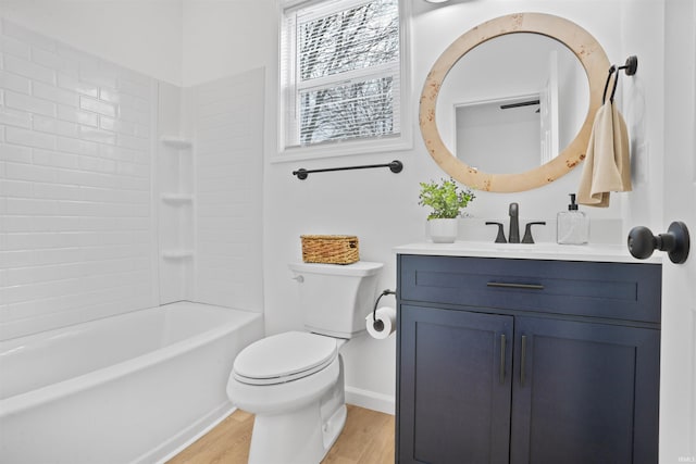 full bathroom featuring  shower combination, toilet, hardwood / wood-style flooring, and vanity