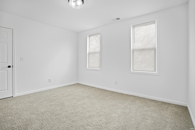 empty room featuring carpet flooring