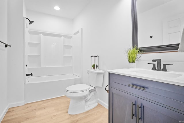 full bathroom featuring wood-type flooring, vanity, toilet, and tub / shower combination