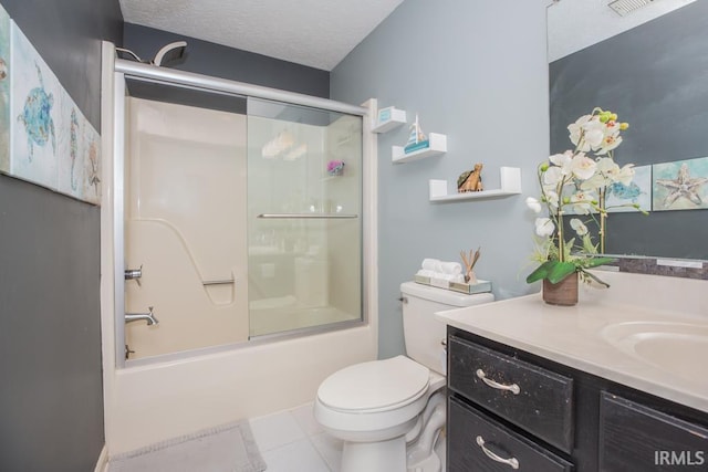 full bathroom featuring tile patterned flooring, toilet, shower / bath combination with glass door, a textured ceiling, and vanity
