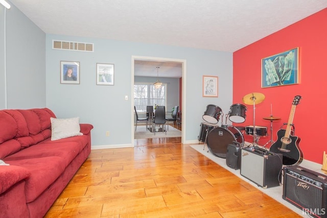 living room with light hardwood / wood-style flooring
