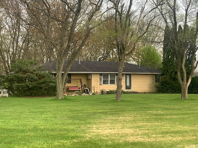 ranch-style house with a front yard