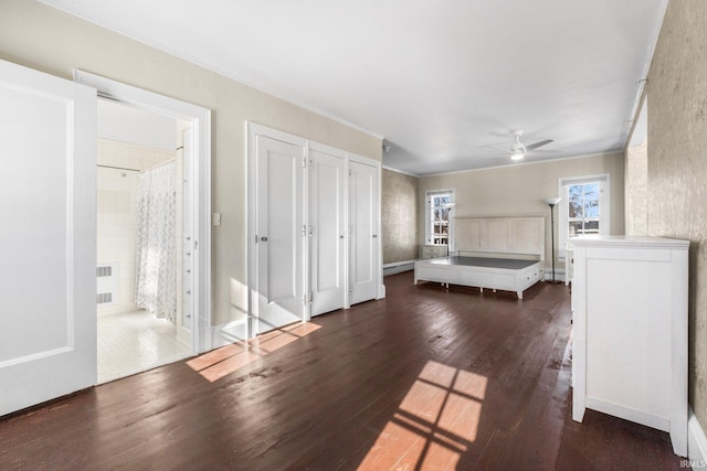 unfurnished bedroom with dark hardwood / wood-style flooring