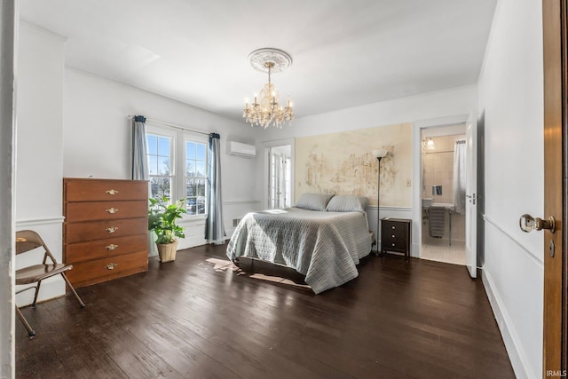 bedroom with dark wood-type flooring, an inviting chandelier, and a wall mounted air conditioner