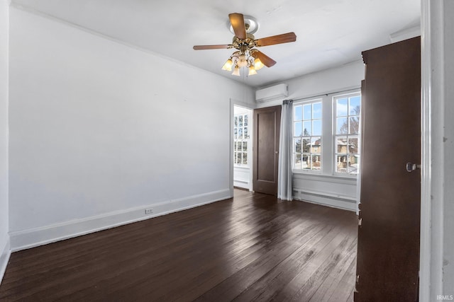 unfurnished bedroom with ceiling fan, dark wood-type flooring, a baseboard heating unit, and a wall mounted AC