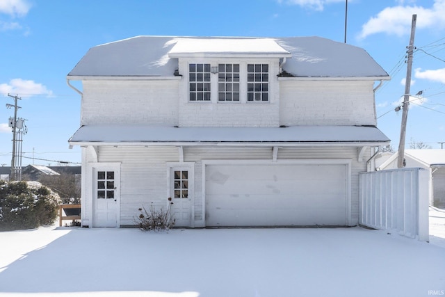 view of front of property with a garage