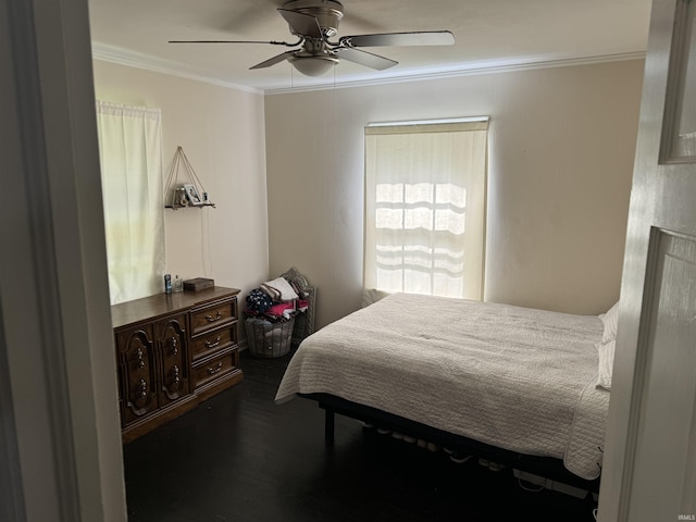 bedroom with ceiling fan, crown molding, and dark hardwood / wood-style flooring