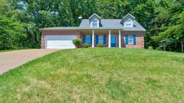 cape cod home with a front lawn and a garage