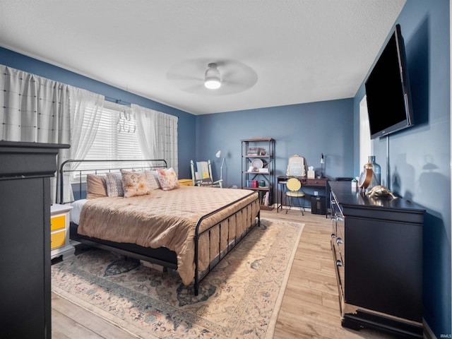 bedroom featuring light wood-type flooring and ceiling fan