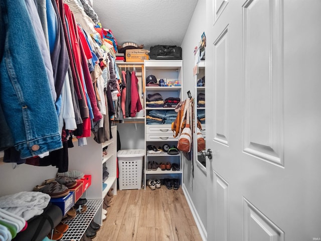 walk in closet featuring light wood-type flooring