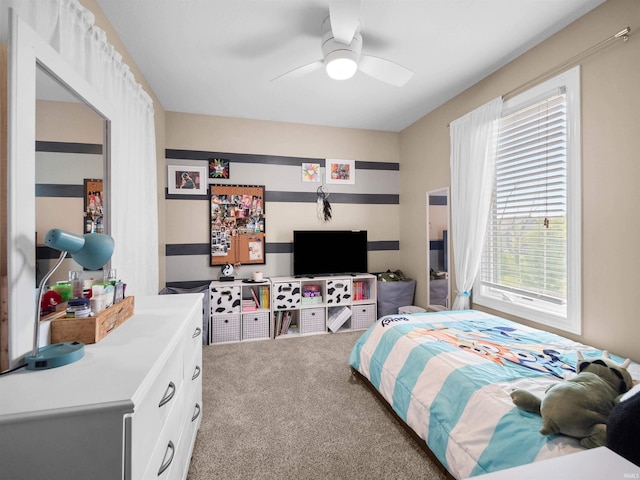 carpeted bedroom featuring ceiling fan