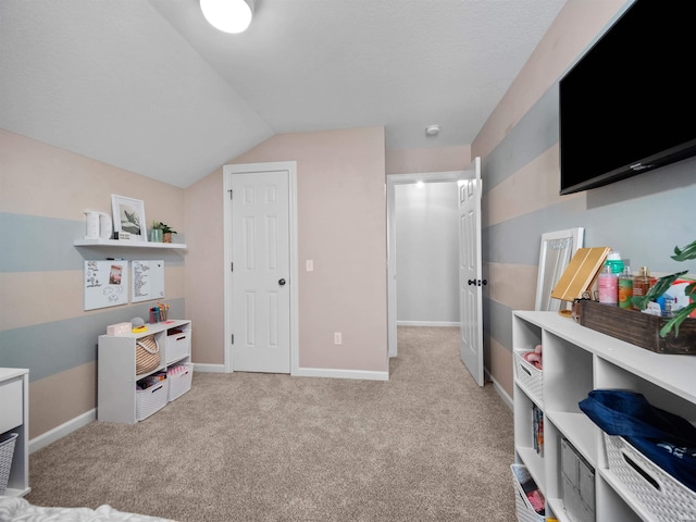 playroom with light carpet and lofted ceiling