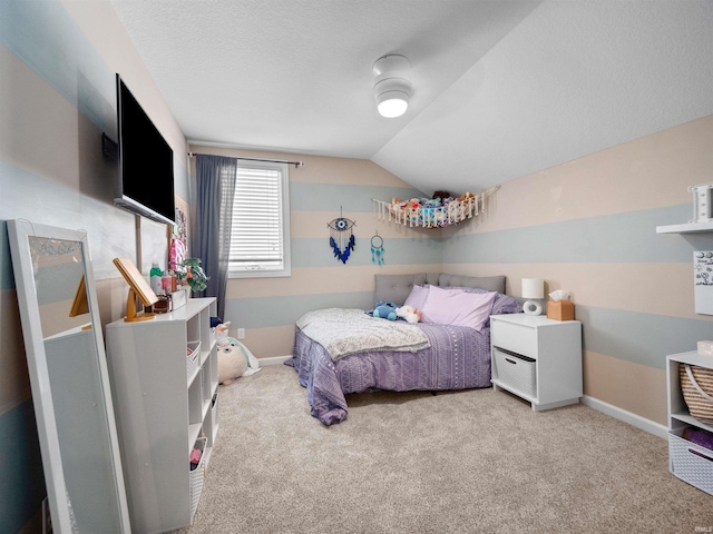 bedroom featuring carpet floors and lofted ceiling