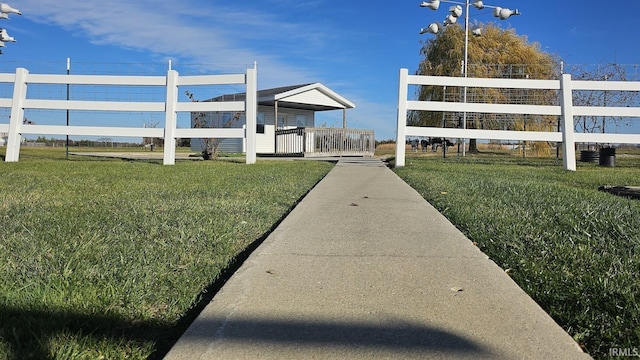 view of property's community with a lawn