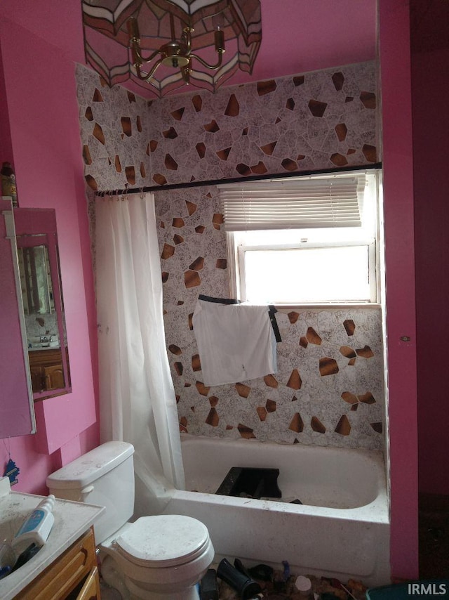 full bathroom with toilet, vanity, and shower / bath combination with curtain