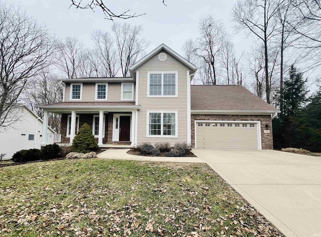 view of front facade featuring a front lawn, a porch, and a garage