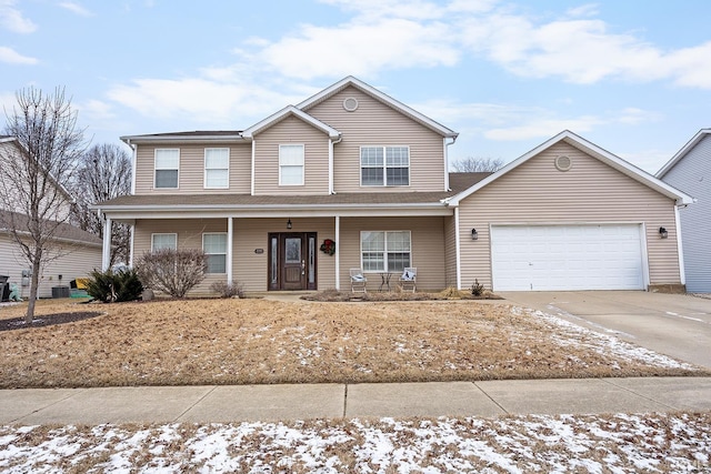 front of property with a garage and covered porch