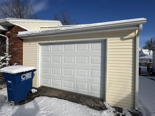 view of snow covered garage