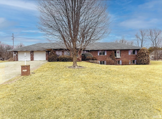 single story home featuring a front lawn and a garage