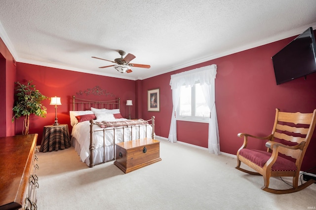 bedroom featuring a textured ceiling, crown molding, light colored carpet, and ceiling fan