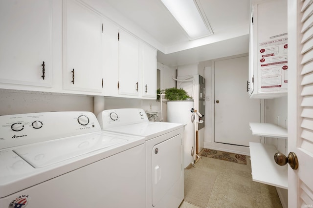 laundry area featuring cabinets and separate washer and dryer